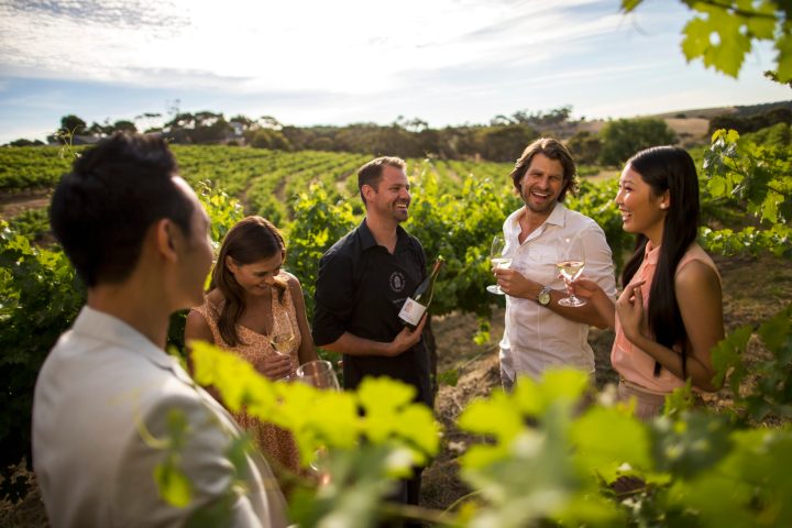 a couple of people that are standing in the grass